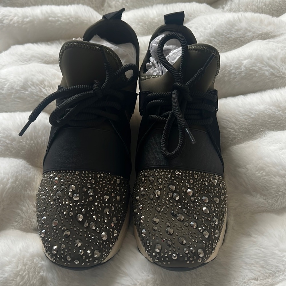 Lament Bling sneaker from Carvela. This black lace Up runner.